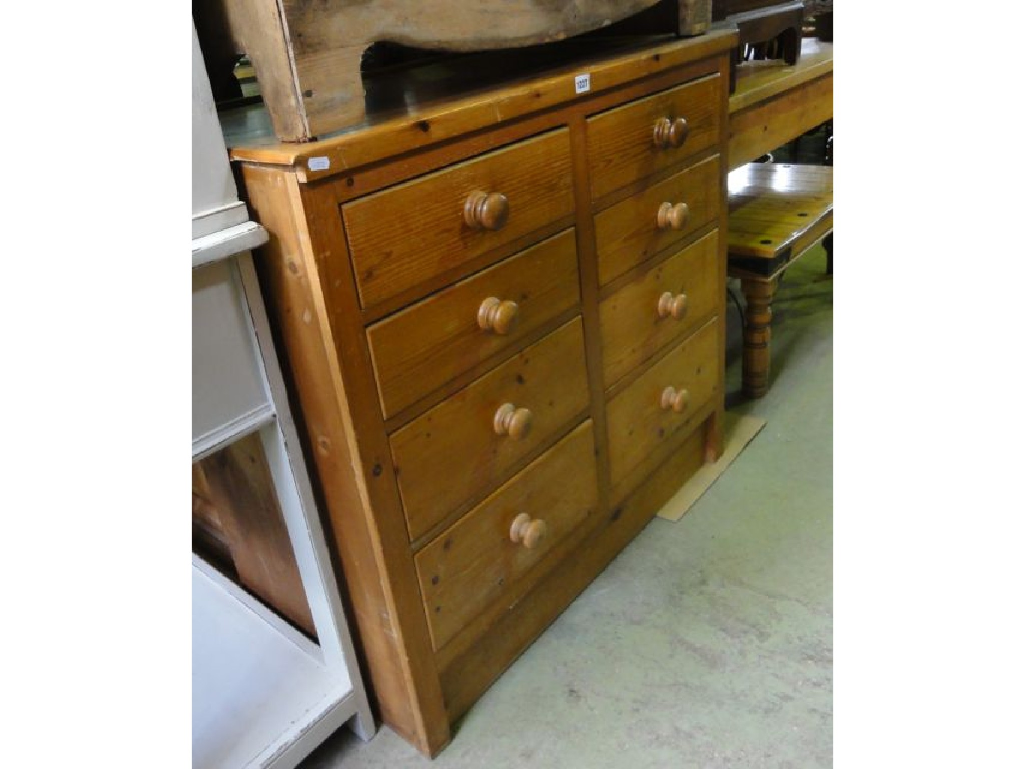 Appraisal: A stripped pine chest presented as eight short drawers