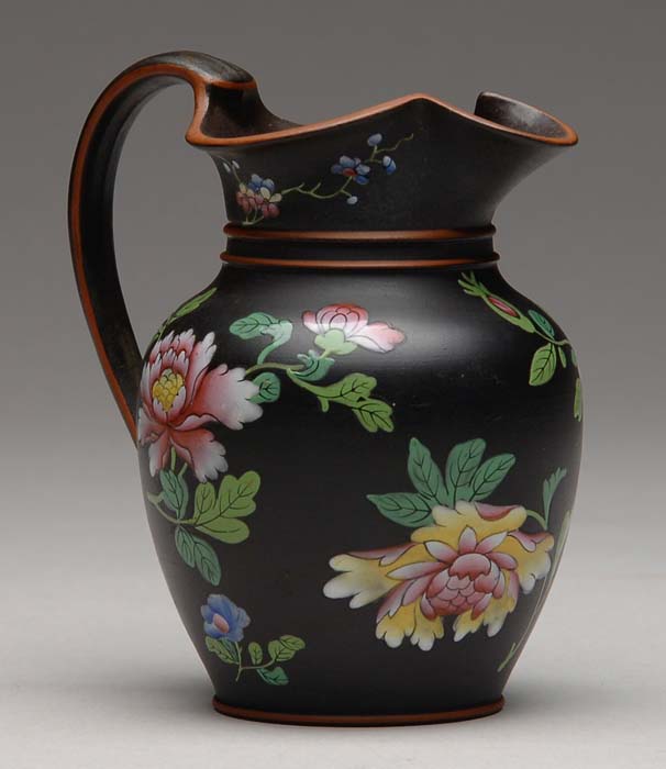 Appraisal: EARLY WEDGWOOD ENAMEL DECORATED BASALT PITCHER AND CREAMER Black ground