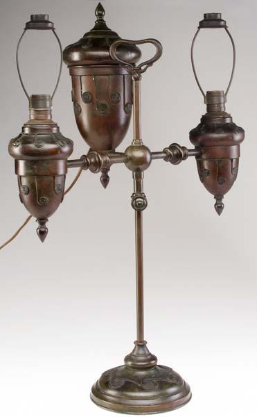 Appraisal: TIFFANY STUDIOS Double-arm bronze student lamp with applied curled rope-like