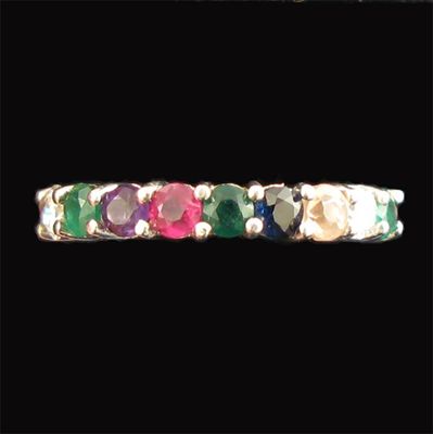 Appraisal: A multi stone set full eternity ring spelling DEAREST three