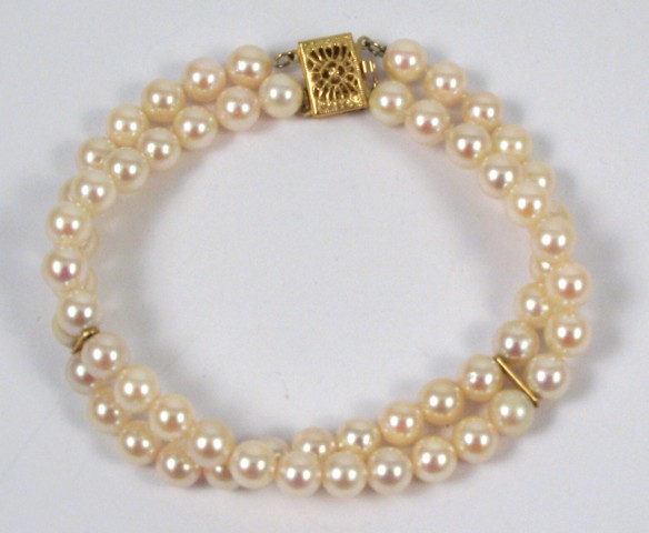 Appraisal: PEARL AND YELLOW GOLD BRACELET The double strand pearl bracelet