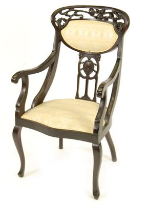 Appraisal: An Aesthetic Movement hardwood armchair the back carved with Art