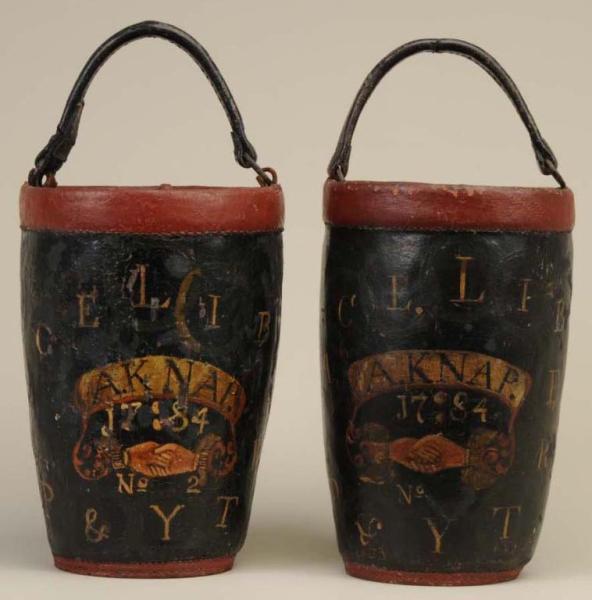 Appraisal: Lot of Two Leather Fire Buckets Canvas Cover Description Buckets