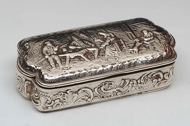 Appraisal: A CONTINENTAL SILVER SNUFF BOX triangular hinged lid with shaped