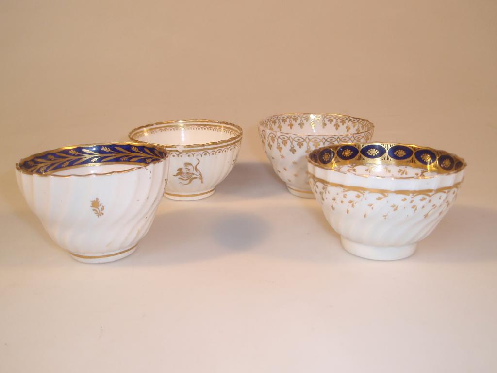 Appraisal: Four thC Worcester porcelain tea bowls of writhen fluted form