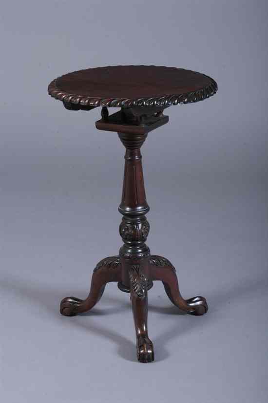 Appraisal: CHIPPENDALE STYLE CARVED MAHOGANY CANDLESTAND Round tilt-top with gadrooned edge