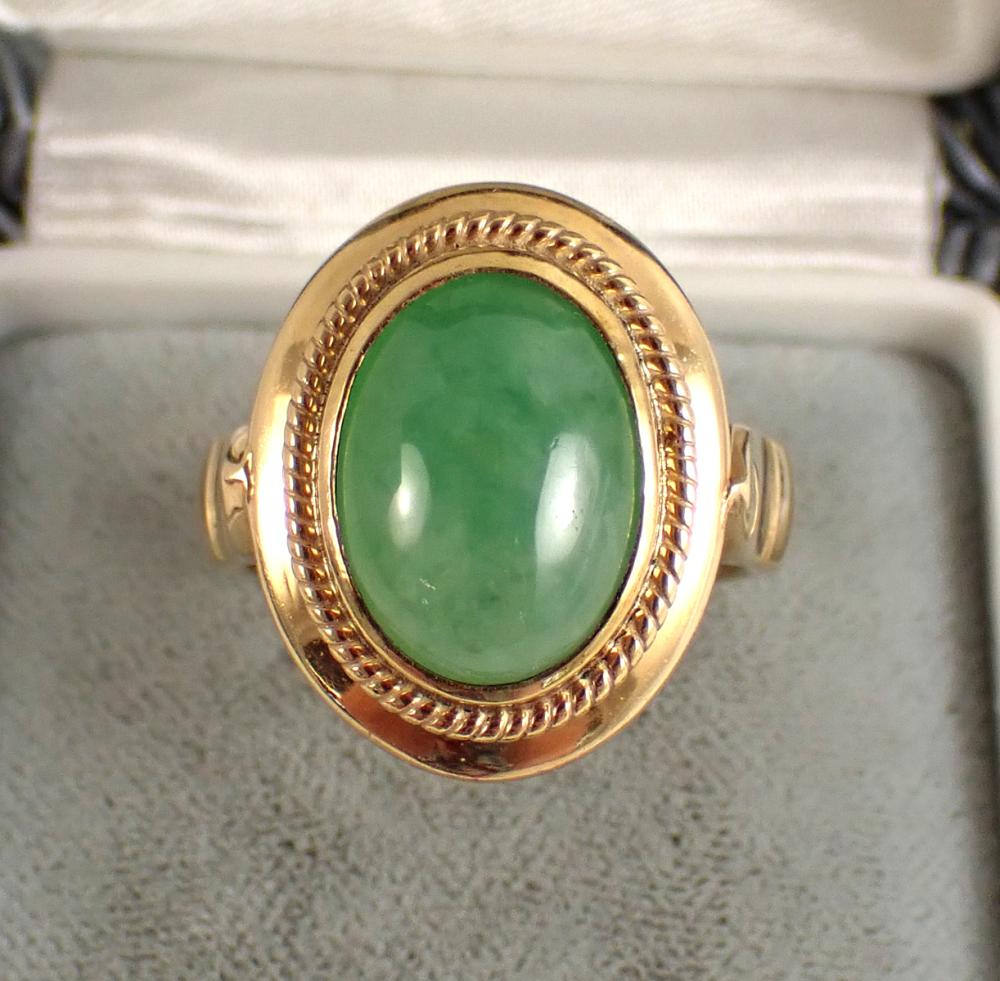 Appraisal: JADEITE JADE AND FOURTEEN KARAT GOLD RING bezel set with