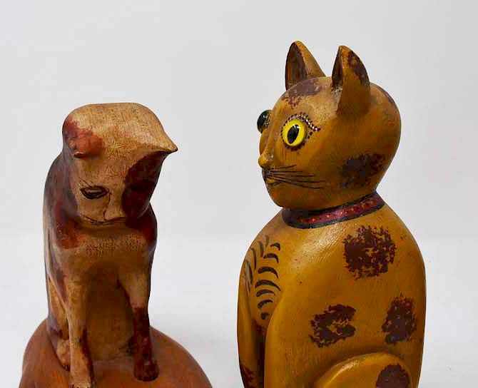 Appraisal: carved wooden cats carved wooden cats tallest is H Condition