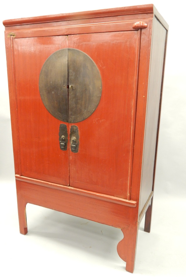 Appraisal: An oriental red painted hardwood cabinet with two doors each