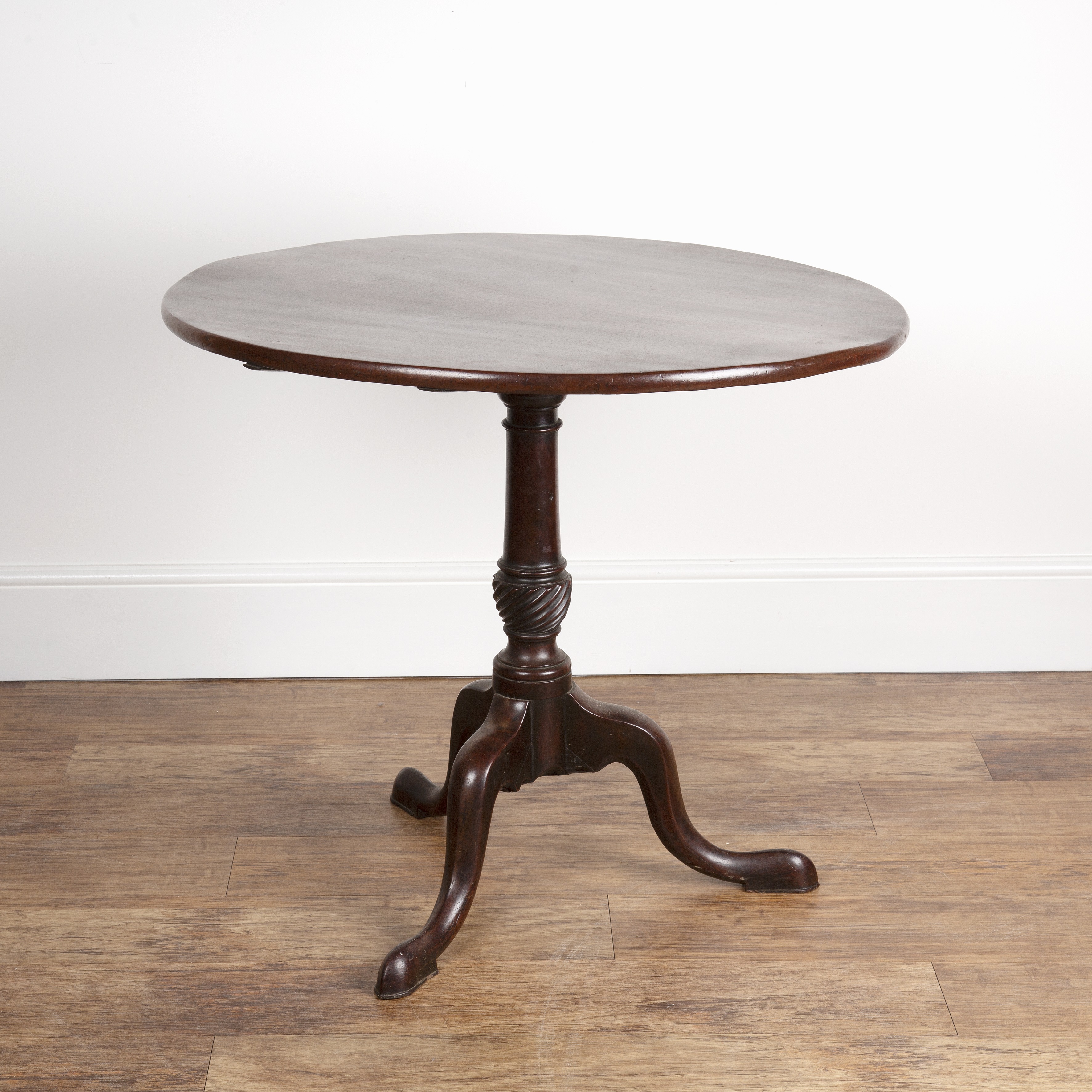 Appraisal: Mahogany large circular tip-up tripod table with carved column and