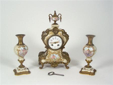 Appraisal: A th century porcelain and gilt bronze mounted clock garniture