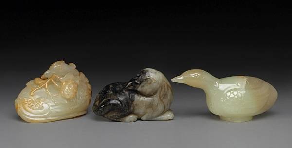 Appraisal: Three nephrite carvings Qing Dynasty The first depicting a recumbent