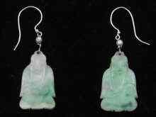 Appraisal: A pair of jade earrings the jade carved as deities