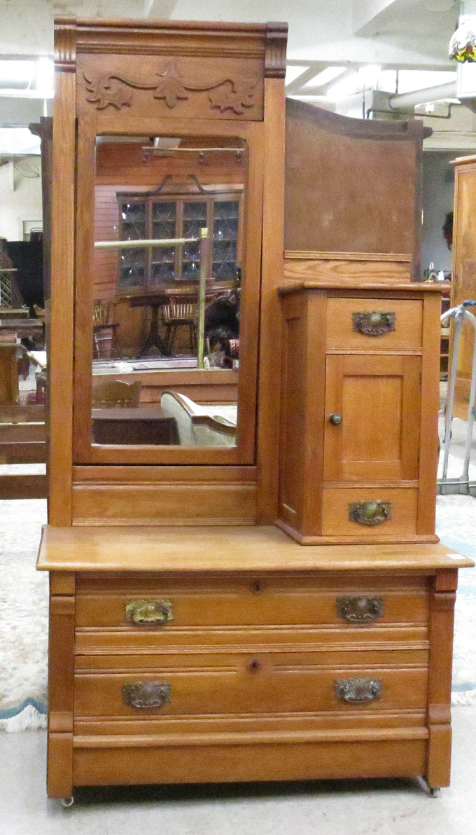 Appraisal: LATE VICTORIAN OAK DRESSER American late th century featuring an