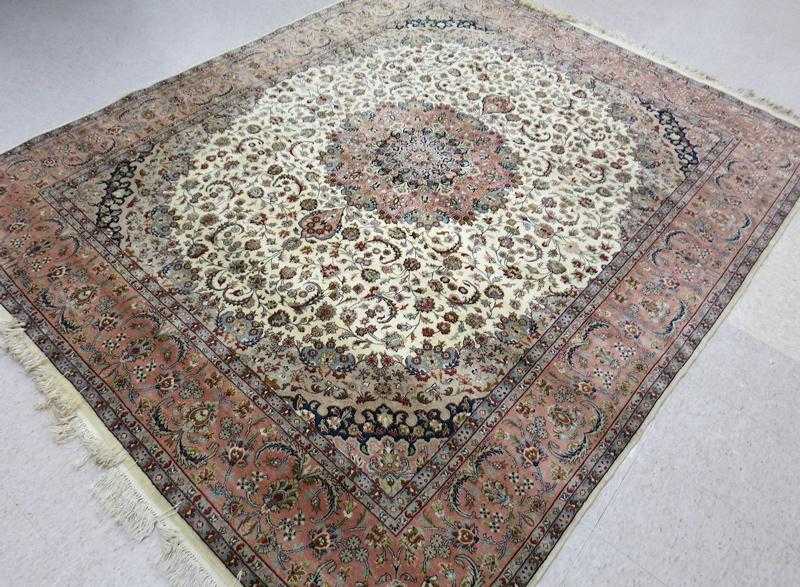 Appraisal: HAND KNOTTED ORIENTAL CARPET Pakistani-Persian floral and floral medallion design