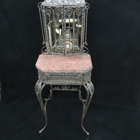 Appraisal: Ornate Wrought Iron Marble TelephoneCabinet in the style of Oscar