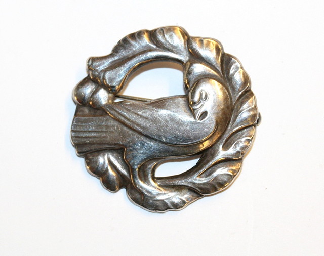 Appraisal: A GEORG JENSEN SILVER BROOCH of a bird amongst branches