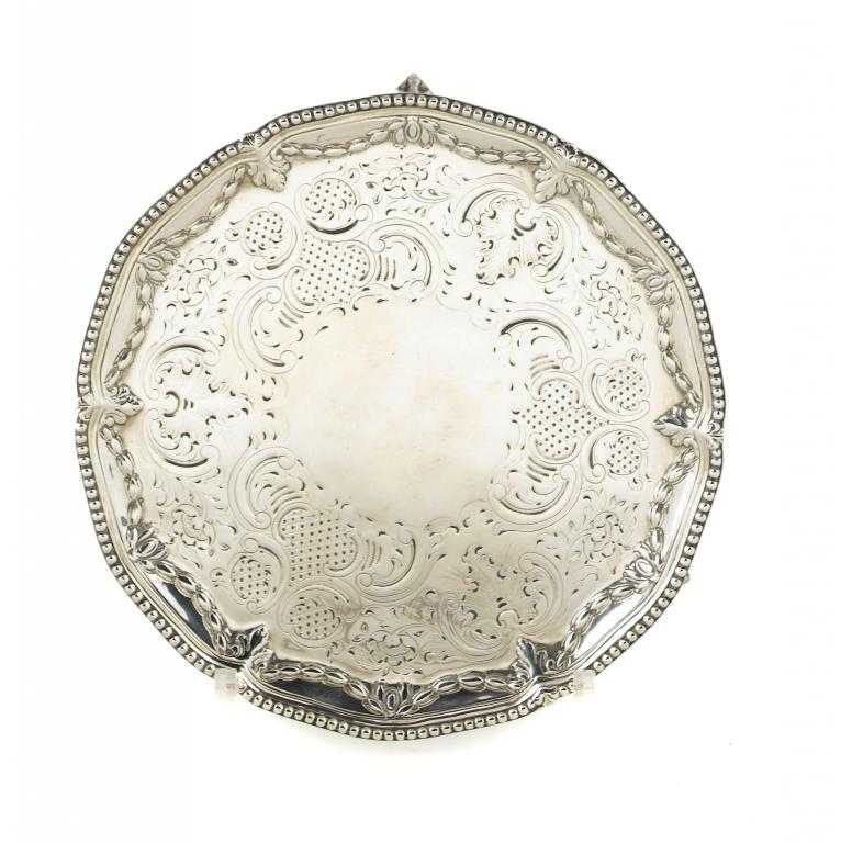 Appraisal: A GEORGE III WAITER with husk border and beaded rim