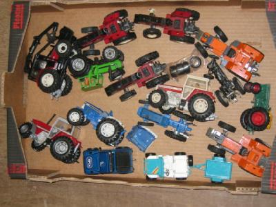 Appraisal: Thirteen Britains and other tractors and various other vehicles P-G