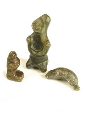 Appraisal: Three Inuit stone carvings one of a male figure one