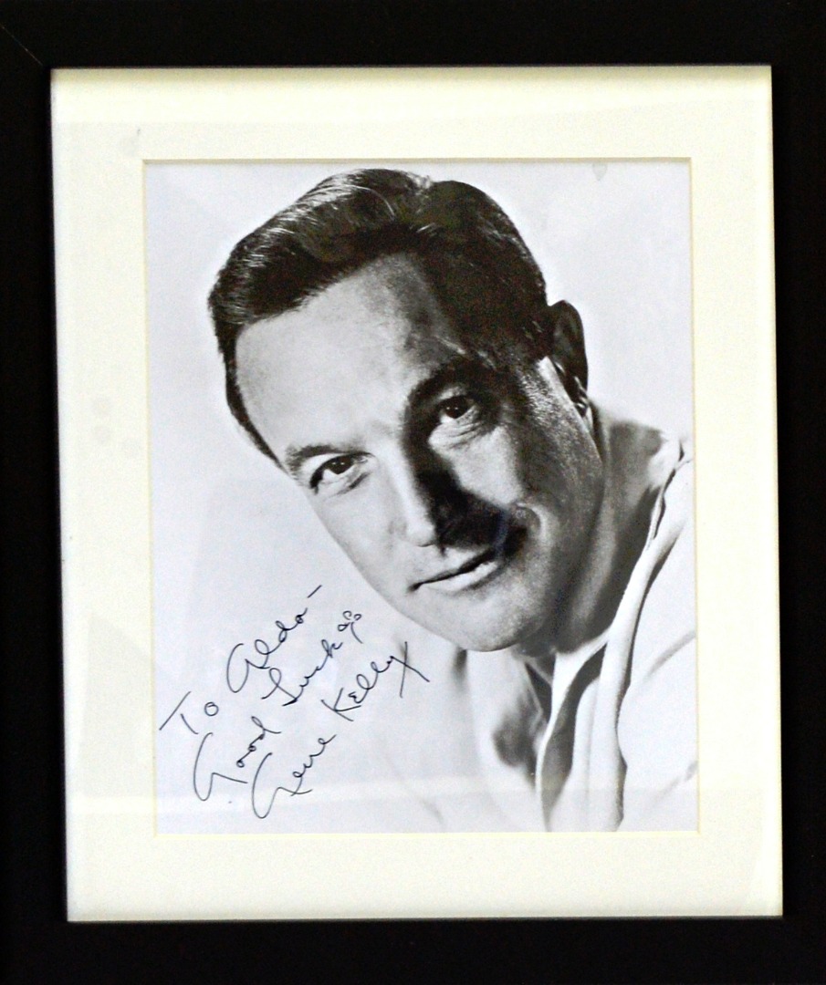 Appraisal: GENE KELLY - mounted framed head shoulders b w portrait