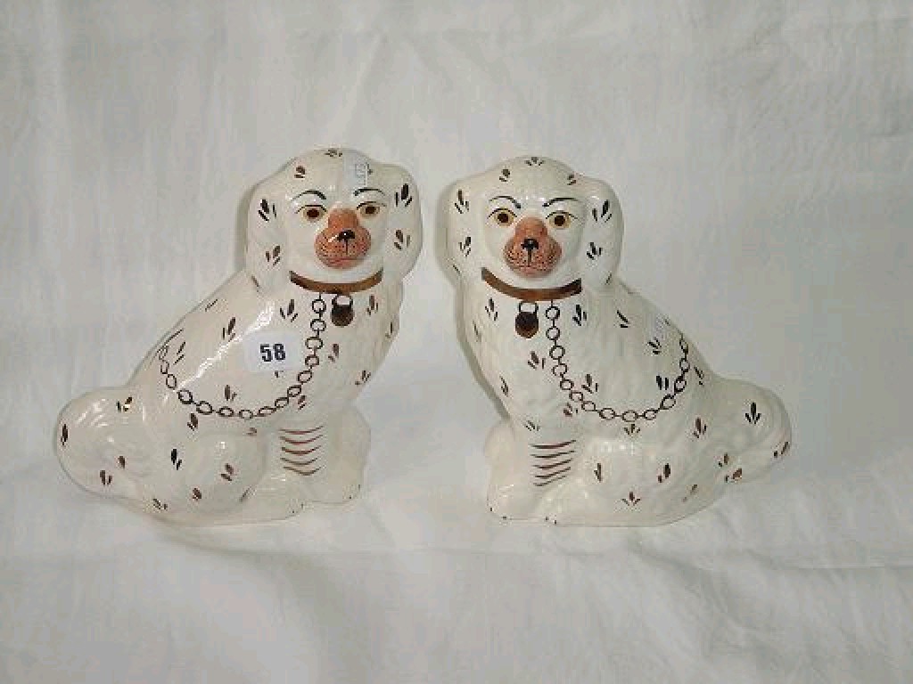 Appraisal: A pair of th century style Staffordshire Spaniels marked to