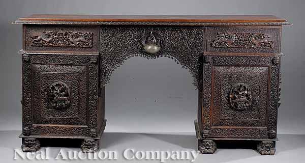 Appraisal: An Antique Burmese Highly Carved Teak Pedestal Sideboard th c