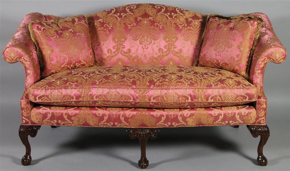 Appraisal: CHIPPENDALE STYLE CARVED MAHOGANY ROSE DAMASK UPHOLSTERED SETTEE having an