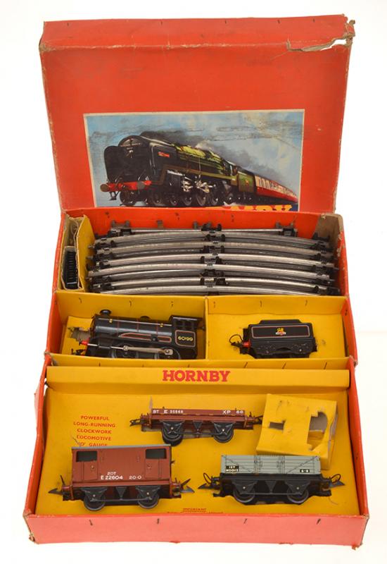 Appraisal: THREE HORNBY O GAUGE CLOCKWORK TRAIN SETS all in original