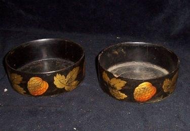 Appraisal: A pair of Regency japanned coasters decorated a band of