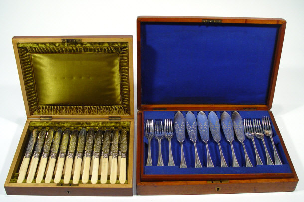 Appraisal: Two mahogany canteens of silver plated cutlery each canteen fitted