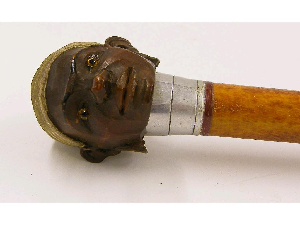 Appraisal: Walking cane the finial carved with the head of an