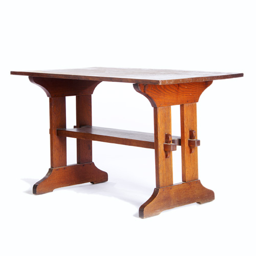 Appraisal: GUSTAV STICKLEY Trestle table its lower shelf mortised through plank