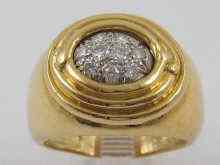 Appraisal: A yellow metal tests ct gold diamond set gent's ring