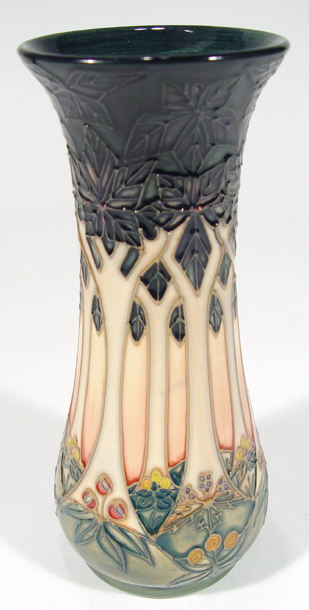 Appraisal: Moorcroft pottery vase hand painted and tubelined with trees impressed