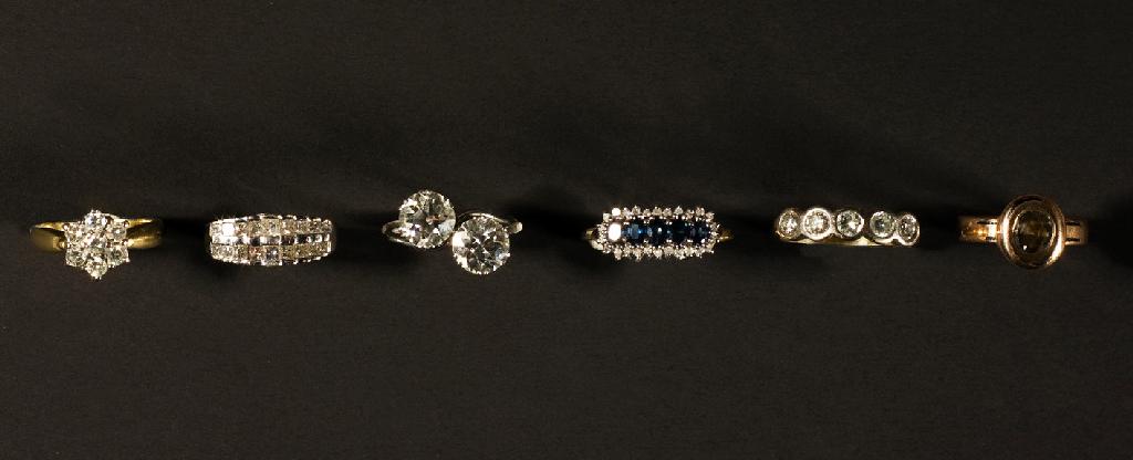 Appraisal: FIVE STONE DIAMOND HALF-HOOP RING set with brilliant cut stones