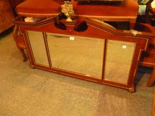 Appraisal: A WILLIAM KENT WALNUT OVERMANTEL MIRROR fitted with three mirror