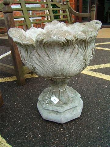 Appraisal: A reconstituted stone garden urn of moulded acanthus leaf form