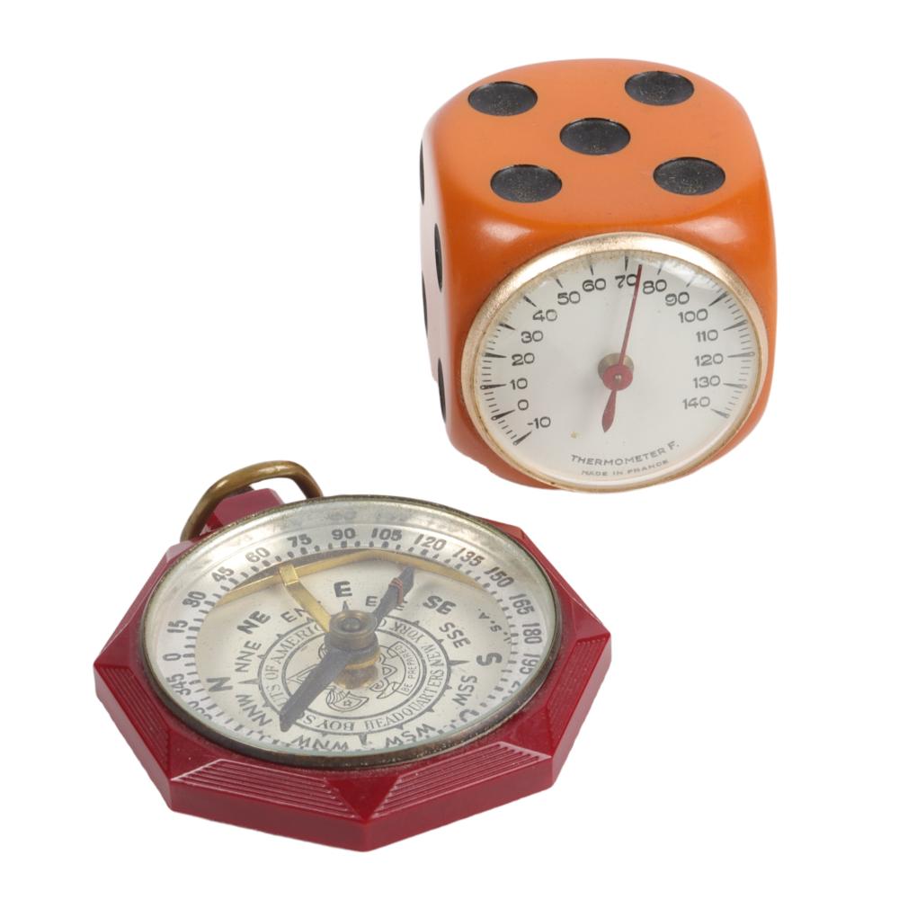 Appraisal: CREAM BAKELITE THERMOMETER AND RED CELLULOID COMPASS H X W