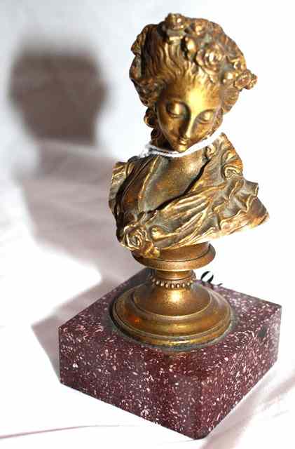 Appraisal: A BRONZE BUST of Marie Antoinette with flowers in her