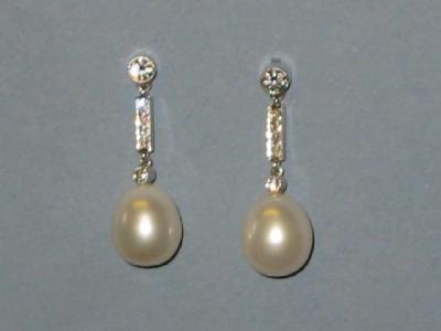 Appraisal: A PAIR OF DIAMOND AND PEARL EARRINGS the slightly pear