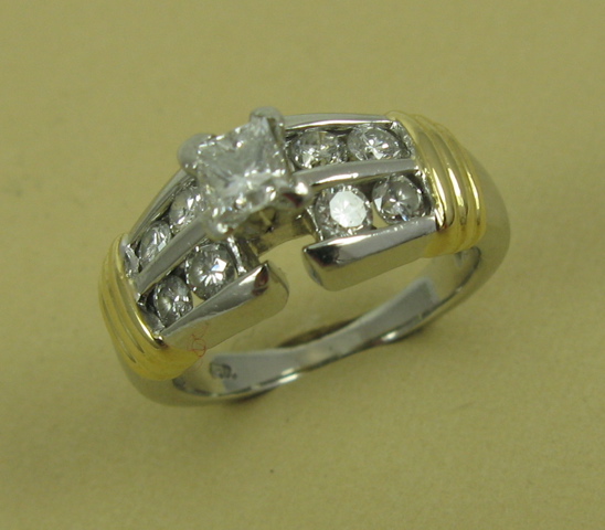 Appraisal: DIAMOND AND EIGHTEEN KARAT GOLD RING set with five round-cut