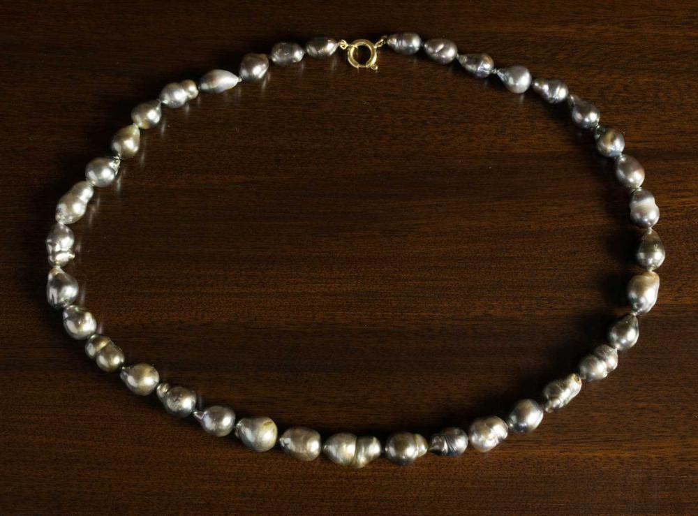 Appraisal: BAROQUE BLACK PEARL AND EIGHTEEN KARAT GOLD NECKLACE strand of