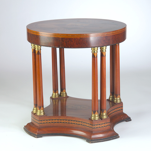 Appraisal: Empire-style occasional table with a circular top resting on four