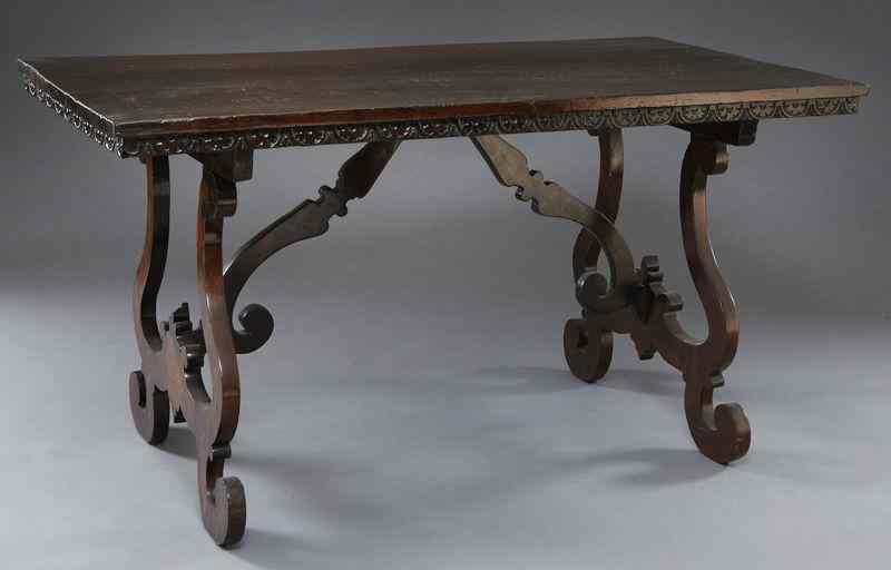 Appraisal: Italian style trestle table having a carved frieze on lyre