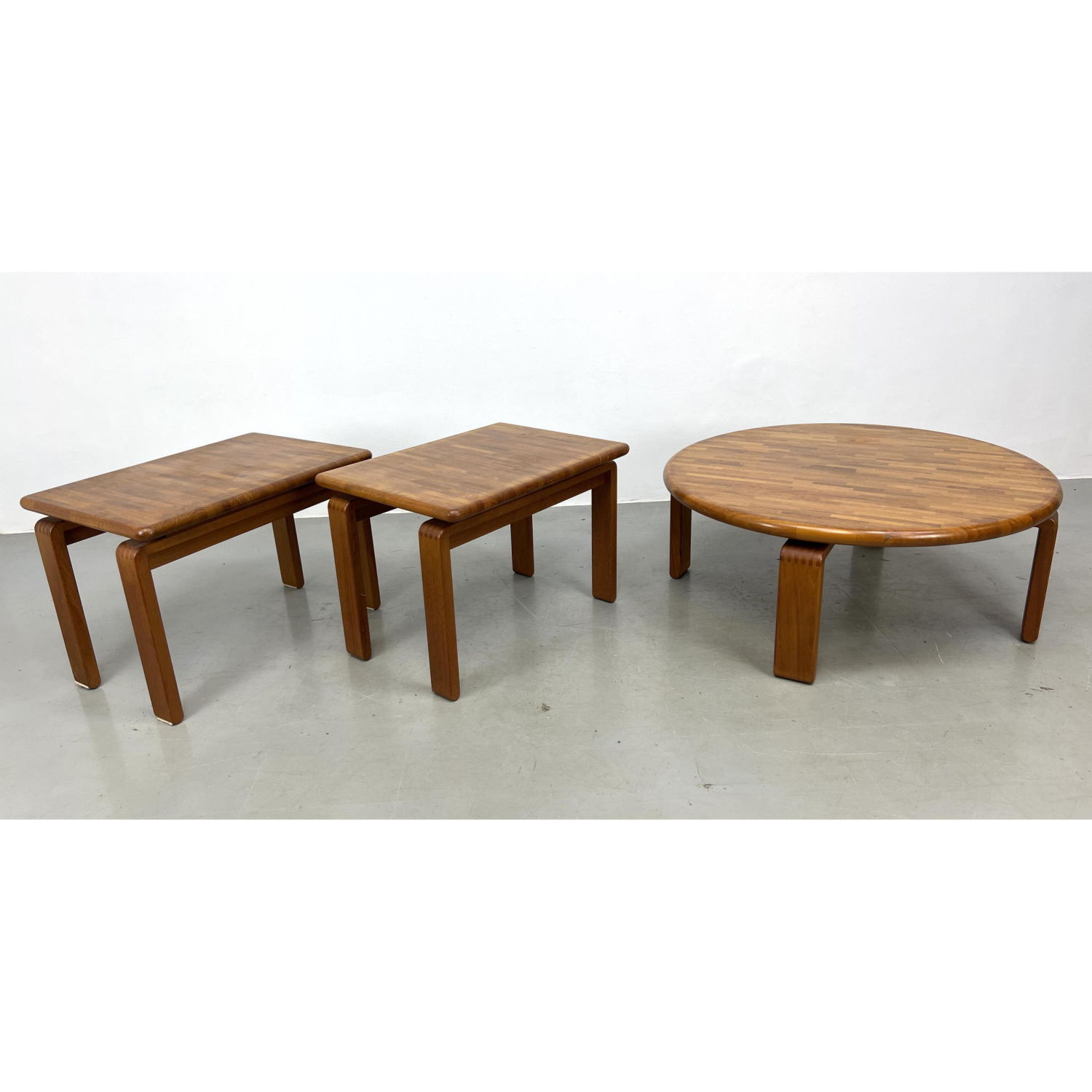 Appraisal: Set D-SAN Teak Tables Round coffee and end tables Tongue