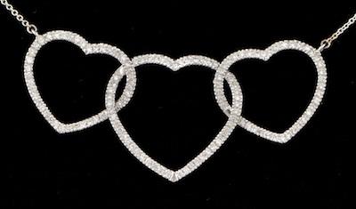 Appraisal: A Three Hearts Diamond Pendant k white gold necklace features