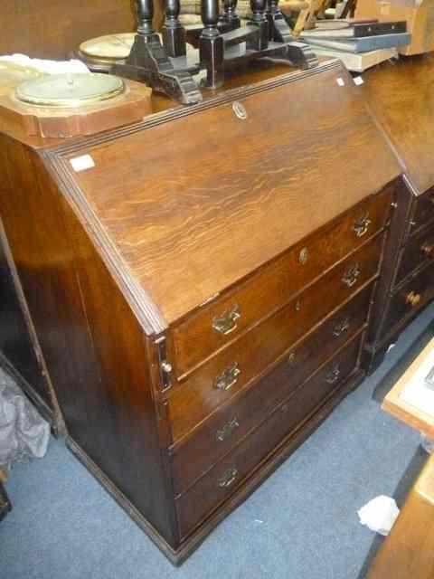 Appraisal: A TH CENTURY OAK BUREAU the fall front enclosing a