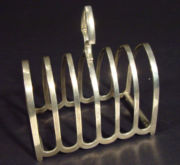 Appraisal: Silver Gothic Arch six slice toast rack Birmingham cm in