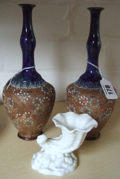 Appraisal: A pair of Doulton Lambeth saltglaze stoneware bottleneck vases with